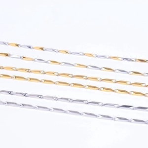 Detail view of assorted gold and silver titanium steel chains with various link designs