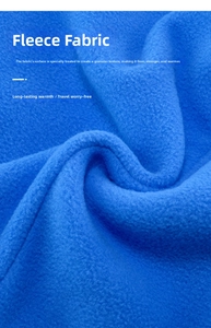Macro shot of bright blue polar fleece fabric showing thick and soft grainy texture