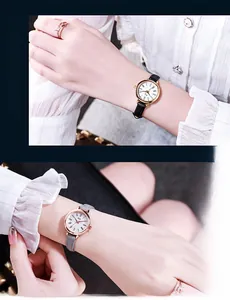 Detail of minimalist small dial watches with thin leather straps in grey and black