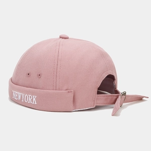 Pink canvas docker hat with New York embroidery and adjustable metal strap closure