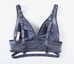 Detail view of steel blue mesh and satin bra back showing size tag UK 34 and stitching