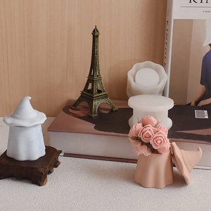 Detail view of ghost-shaped silicone molds and storage jars with wizard hat lids