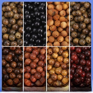 Selection of diverse natural sandalwood beads with organic grain for DIY jewelry