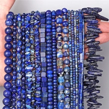Detailed view of deep blue natural sodalite beads in various shapes and stone textures