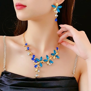 Detail of vintage flower jewelry set with blue gemstones and sparkling crystals