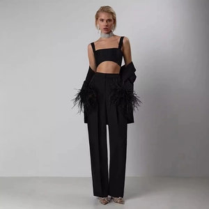 Three-piece black suit set with feather cuffs, cropped top and high-waist pants