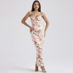 Detailed close-up of pink floral print dress with satin finish and lace-up back