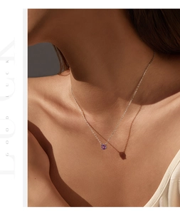 Close-up of S925 silver necklace with rose-cut lavender zirconia on model's neckline