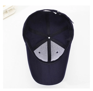 Detail view of the navy blue baseball cap interior structure with reinforced stitching