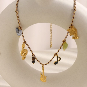 Braided chord necklace with 18K gold guitar and musical note pendants for women