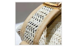 Detailed macro view of neat stitching on the straw and faux leather textured surface