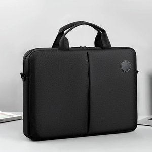 Minimalist black laptop messenger bag with dual handles and durable fabric for business