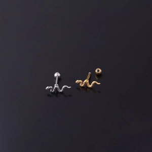 Surgical steel snake body piercing jewelry set in gold and silver finish on black back