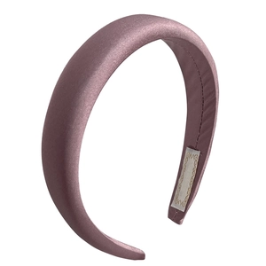 Elegant thick silk headband in pink purple color with glossy texture on white background