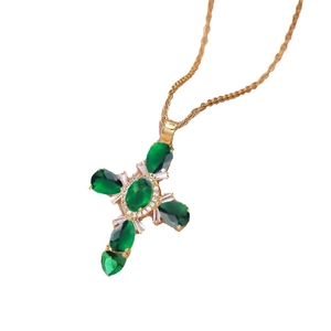 Elegant gold cross necklace featuring green oval stones and sparkling white zircons