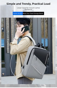 Close-up of side view showing USB charging port on waterproof gray business backpack