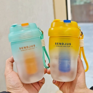 Close-up of portable gradient dual-drink cups with matching handles and built-in filters