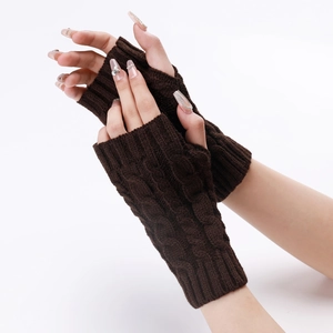 Detailed knit cable pattern on brown fingerless gloves showing warm winter texture