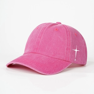 Washed pink cotton baseball cap with white cross print and adjustable strap design