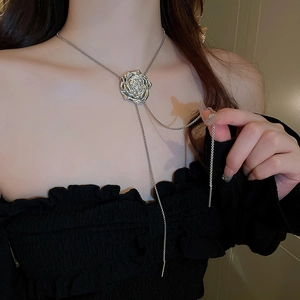 Silver metallic rose pendant lariat necklace with bead chain on model neck
