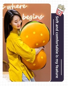 Soft hamburger plush pillow with layered design held by a person showing its large size