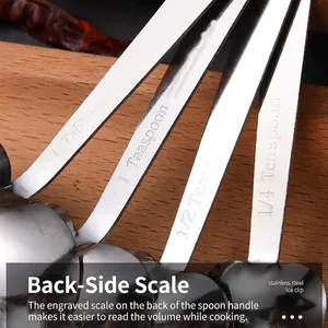 4-piece heart-shaped stainless steel measuring spoon set with engraved scales on wood