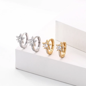 Close-up of S925 sterling silver star hoop earrings in gold and silver with cubic zirconia