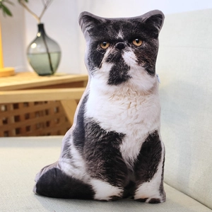 Detailed view of a lifelike Exotic Shorthair cat pillow cushion on a beige sofa at home