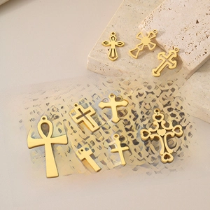 Detail view of 18K gold-plated stainless steel hollow cross and Ankh charms for jewelry DIY