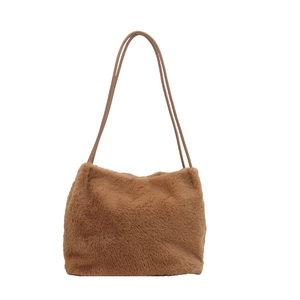Brown fuzzy faux fur shoulder bag with slender leather straps for winter style