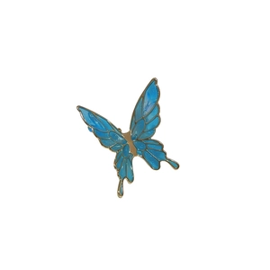 Elegant blue butterfly ear cuff in gold plating with translucent wings on white background