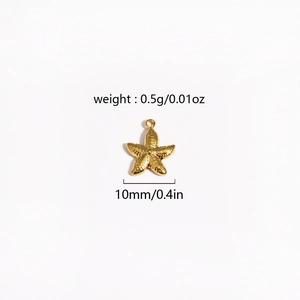 Macro shot of 10mm gold starfish metal charm with weight and size specifications
