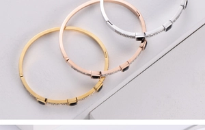 Detail of three-piece set titanium steel bracelets with black crystals and micro-pavé zircons
