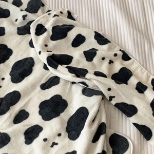 Thick coral fleece cow print towel with soft texture and absorbent fiber material