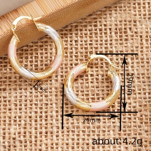 Three-tone textured metal hoop earrings in gold silver and rose gold finishes