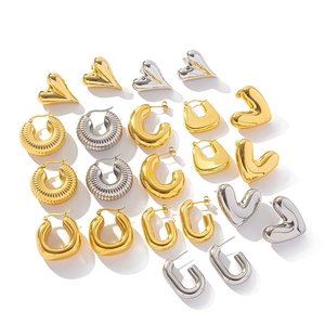 Minimalist geometric titanium earrings set in gold and silver with heart and hoop designs