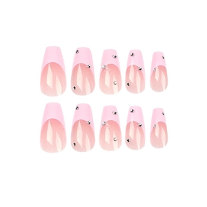 Pink French style press on nails with rhinestones in long coffin shape on white background