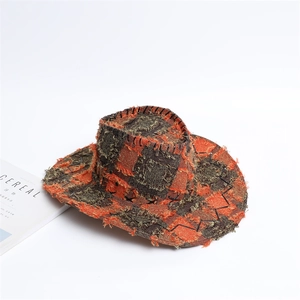 Detail of checkered western cowboy hat with frayed edges and contrast stitching texture