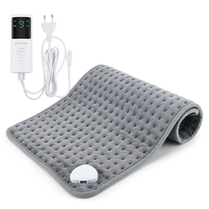 Detail of grey heating pad with digital controller and quilted soft velvet texture