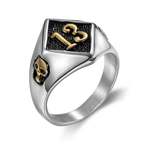 Silver stainless steel ring with black face, gold number 13, and side skull carving