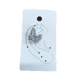 Elegant silver butterfly ear cuff with sparkling zircon crystals on a display card