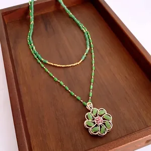 Vintage 18k gold plated floral necklace with green glass beads and flower pendant