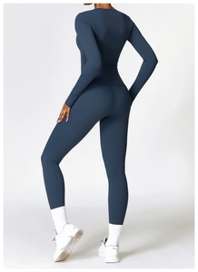 Rear view of high-waisted lift yoga pants and long sleeve top in dark blue fabric