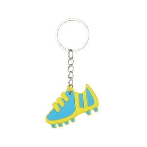 Detailed view of a blue and yellow soccer shoe keychain made of soft PVC with metal ring