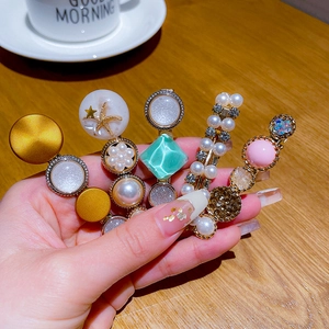 Set of five stylish pearl and rhinestone hair clips in gold finish for women