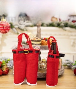 Detail of Christmas Santa pants gift bag and wine bottle cover with velvet and gold buckle
