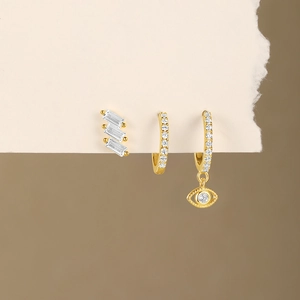 Close-up of gold S925 sterling silver evil eye earring set with sparkling zircon stones