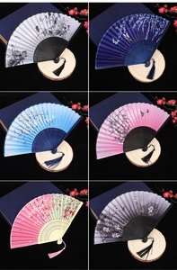 Detail of six Chinese folding fans with ink floral patterns and decorative tassels