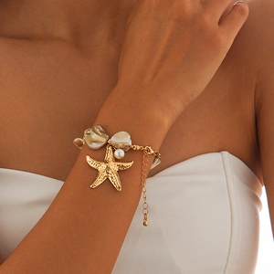 Golden starfish bracelet with pearls and natural shells for summer beach vacations