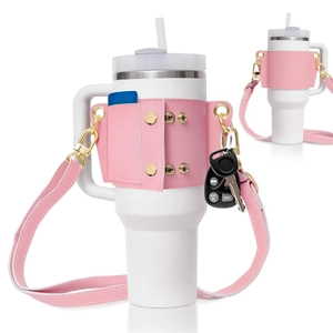Pink faux leather tumbler carrier with shoulder strap and gold hardware for 40oz cups
